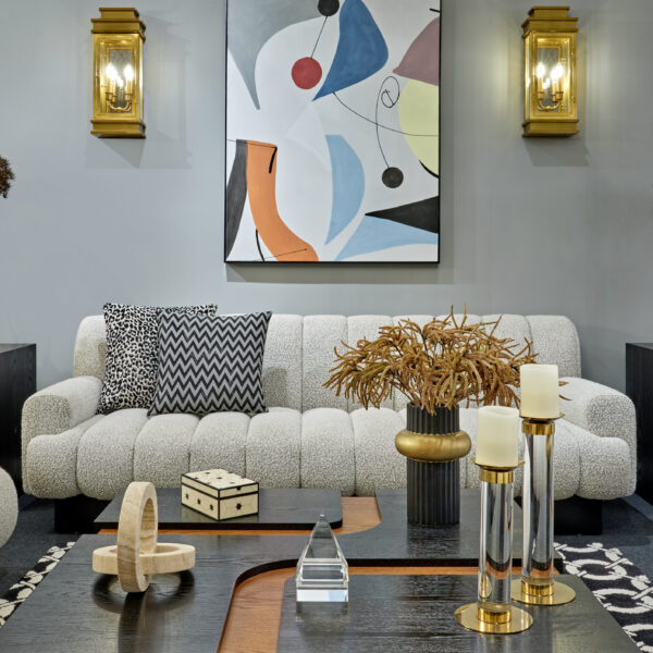 Liang & Eimil's Showroom showcasing the showroom space with boucle sofa, occasional chairs and wooden coffee table.